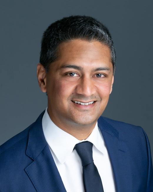 team member professional headshot in suit