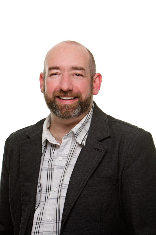team member professional headshot in suit